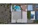 Aerial shot of property including pool, green turf, a home and surrounding desert landscape at 420 Dakar St, Henderson, NV 89015