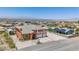 Expansive home showcasing a three-car garage, a detailed roof, and a neighborhood view against a mountain backdrop at 420 Dakar St, Henderson, NV 89015