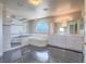 Luxurious bathroom with a large tub, walk-in shower, dual vanity, and modern tile work at 420 Dakar St, Henderson, NV 89015