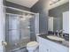Stylish bathroom featuring modern fixtures, a glass-enclosed shower, and a sleek vanity at 420 Dakar St, Henderson, NV 89015