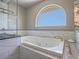 Relaxing bathroom with a large soaking tub and tile surround at 420 Dakar St, Henderson, NV 89015