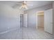 Bedroom showcasing tile floors, ceiling fan, two doors, and a large closet at 420 Dakar St, Henderson, NV 89015