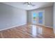Bedroom with beautiful hardwood floors and a sliding glass door leading to a balcony at 420 Dakar St, Henderson, NV 89015