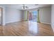 Spacious bedroom with gleaming hardwood floors and a sliding glass door to a balcony with scenic views at 420 Dakar St, Henderson, NV 89015