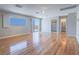 Bright, spacious bedroom with hardwood floors, large windows, and access to a balcony with scenic views at 420 Dakar St, Henderson, NV 89015