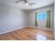 Cozy bedroom featuring hardwood floors and natural light from a large window at 420 Dakar St, Henderson, NV 89015