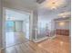 Elegant foyer featuring hardwood floors, staircase, and a view to a large balcony through french doors at 420 Dakar St, Henderson, NV 89015