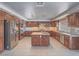 Spacious kitchen features custom cabinets, granite countertops, stainless steel appliances and center island at 420 Dakar St, Henderson, NV 89015