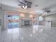 Open living room features tile floors, a fireplace, a wet bar and pool access at 420 Dakar St, Henderson, NV 89015