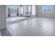 Bright, open-concept living area with stylish tile floors and contemporary fireplace at 420 Dakar St, Henderson, NV 89015