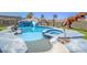 Unique backyard pool area featuring rock waterfall features, and dinosaur features with a large spa at 420 Dakar St, Henderson, NV 89015
