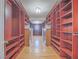Large walk-in closet with custom wood shelving, offering ample storage and organization space at 420 Dakar St, Henderson, NV 89015