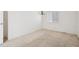 Clean and simple bedroom with carpet flooring and a bright window at 4323 Village Spring St, Las Vegas, NV 89147