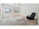 Spacious bedroom with carpet, a ceiling fan, and large windows for natural light and comfort at 4323 Village Spring St, Las Vegas, NV 89147