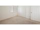 Carpeted bedroom with window and closet offers ample space for rest and relaxation at 4323 Village Spring St, Las Vegas, NV 89147