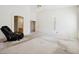 Expansive bedroom featuring neutral carpet and an en-suite bathroom at 4323 Village Spring St, Las Vegas, NV 89147