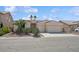Charming single-story home with desert landscaping and a three-car garage at 4323 Village Spring St, Las Vegas, NV 89147