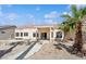 Charming single-story home featuring desert landscaping and a covered patio at 4323 Village Spring St, Las Vegas, NV 89147