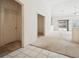 Spacious living room with carpeted floors and ample natural light at 4323 Village Spring St, Las Vegas, NV 89147