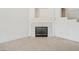 Spacious living room with fireplace, ceiling fan, neutral carpet and lots of natural light at 4323 Village Spring St, Las Vegas, NV 89147