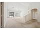 Bright and airy living room with large windows and sliding door with access to the backyard at 4323 Village Spring St, Las Vegas, NV 89147
