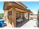 Relaxing outdoor space featuring a covered patio and brick pavers in the backyard at 462 Fortissimo St, Henderson, NV 89011