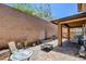 Backyard with covered patio area, tall brick walls, and space to relax at 462 Fortissimo St, Henderson, NV 89011