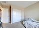 Cozy bedroom featuring neutral walls, carpeted floor, closet, and a comfy bed at 462 Fortissimo St, Henderson, NV 89011