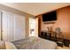 Bedroom with closet doors and a tv on the wall at 462 Fortissimo St, Henderson, NV 89011