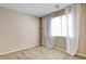 Neutral bedroom featuring plush carpeting, natural light, and minimalistic design with a large window at 462 Fortissimo St, Henderson, NV 89011