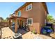 Exterior view of house with covered patio and well-manicured yard at 462 Fortissimo St, Henderson, NV 89011