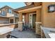 Inviting front porch with stylish brick pillars, a cozy chair, and charming decor at 462 Fortissimo St, Henderson, NV 89011