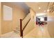 Hallway leading to an open-concept kitchen and dining area with a staircase at 462 Fortissimo St, Henderson, NV 89011