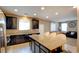 Modern kitchen with granite countertops, a large island, and stainless steel appliances at 462 Fortissimo St, Henderson, NV 89011