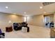 Upstairs living room with wood floors, cozy seating, a decorative ottoman, and views into the office space at 462 Fortissimo St, Henderson, NV 89011