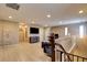 Upstairs living room with wood floors, comfortable seating, a large screen television and abundant natural light at 462 Fortissimo St, Henderson, NV 89011