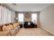 Inviting living room with comfortable seating, natural light, and stylish decor at 462 Fortissimo St, Henderson, NV 89011