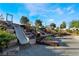 Beautiful community playground with slides built into landscaped hillside; providing a fun outdoor space for children at 462 Fortissimo St, Henderson, NV 89011