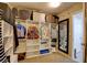 Walk-in closet featuring shelves, hanging rods, and a full length mirror at 462 Fortissimo St, Henderson, NV 89011