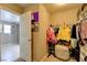 Walk-in closet features neutral walls, lots of hanging space, and shelving at 462 Fortissimo St, Henderson, NV 89011