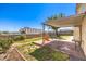 Spacious backyard with a covered patio, perfect for outdoor seating and entertaining with views of the surrounding area at 504 Arthur Ave, Henderson, NV 89015