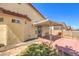 Cozy backyard patio area with a metal awning offering shade for outdoor relaxation and enjoyment at 504 Arthur Ave, Henderson, NV 89015