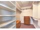 Walk-in closet with built-in shelving and drawers for ample storage space at 504 Arthur Ave, Henderson, NV 89015