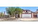 Charming single-story home featuring a two-car garage and low maintenance landscaping in a sunny neighborhood at 504 Arthur Ave, Henderson, NV 89015