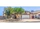Charming single-story home featuring a two-car garage and low maintenance landscaping in a sunny neighborhood at 504 Arthur Ave, Henderson, NV 89015