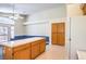 Spacious kitchen featuring an island, oak cabinets, and a refrigerator at 504 Arthur Ave, Henderson, NV 89015