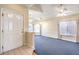 Bright living room with neutral paint, carpet, and multiple windows offering abundant natural light at 504 Arthur Ave, Henderson, NV 89015