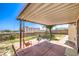 Backyard patio features a covered area with seating, a garden, and a block wall at 504 Arthur Ave, Henderson, NV 89015