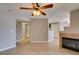 Spacious living room with fireplace, ceiling fan and wood flooring at 698 S Racetrack Rd # 114, Henderson, NV 89015