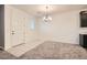 Well-lit dining area adjacent to the kitchen with modern light fixture and easy access to the front door at 762 Star Estates Ave # 0, North Las Vegas, NV 89086